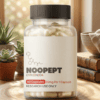A close-up shot of a standard 10mg Noopept capsule resting on a scale, demonstrating the precise daily Noopept dosage for cognitive enhancement.